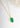 Gold necklace with a green pendant on a white background