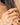 Close-up of a hand wearing a gold ring with a purple gemstone. amethyst gemstone jewellery
